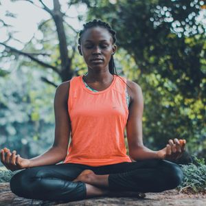 Person in a calm meditative state, focusing on breathing.